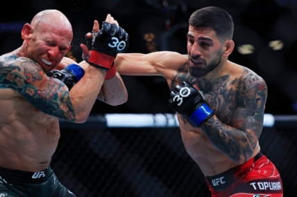 Ilia Topuria lands a punch on Josh Emmett in a featherweight bout during the UFC Fight Night event Saturday, June 24, 2023 at VyStar Veterans Memorial Arena in Jacksonville, Fla. Ilia Topuria defeated Josh Emmett by unanimous decision in five rounds.