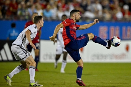 Jul 4, 2023; Frisco, Texas, USA; FC Dallas midfielder Sebastian Lletget (12) contols the ball in front of D.C. United forward Pedro Santos (7) during the second half at Toyota Stadium. Mandatory Credit: Jerome Miron-USA TODAY Sports